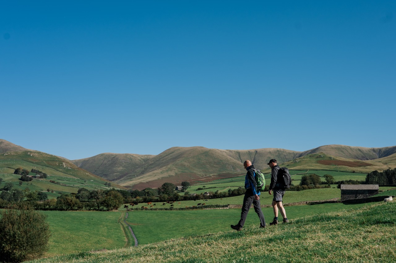 Two men walking - symbolising opening up when traditional therapy doesn't feel right.